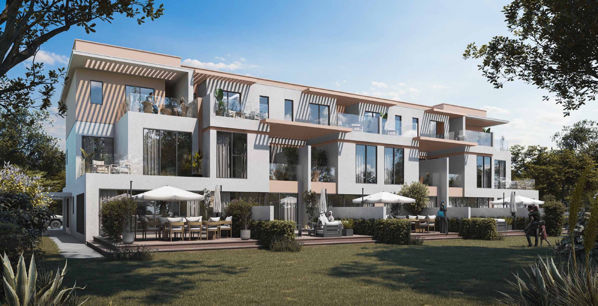 DAMAC Islands 2 Dubai twin villa exterior — landscaped garden frontage with tiered terraces and outdoor dining