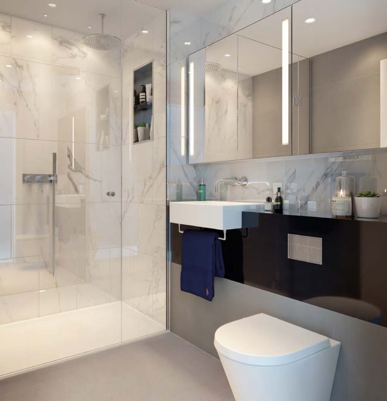 Harcourt Gardens South Quay Plaza Canary Wharf E14 marble-finished bathroom with rainfall shower, wall-hung basin and mirrored cabinet