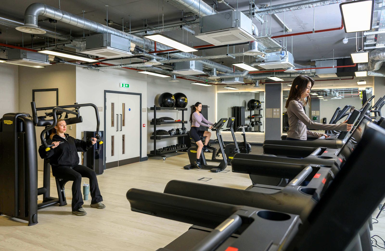 Lombard Square Plumstead SE28 residents gym with treadmills, resistance machines and spin bikes — part of the on-site opt-in gym amenity