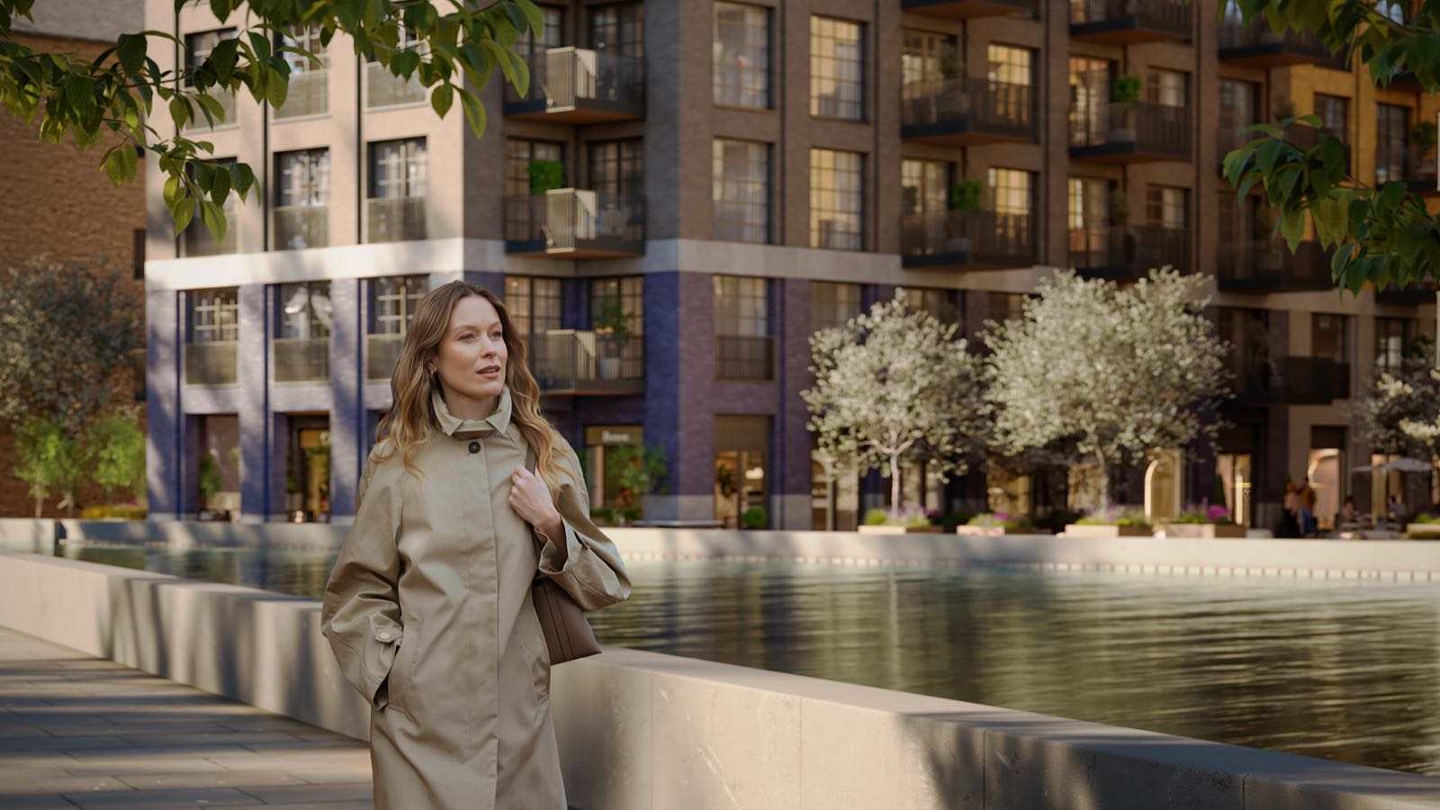Ransome's Wharf Battersea SW11 London dockside reflecting pool and red-brick apartments with blossom trees