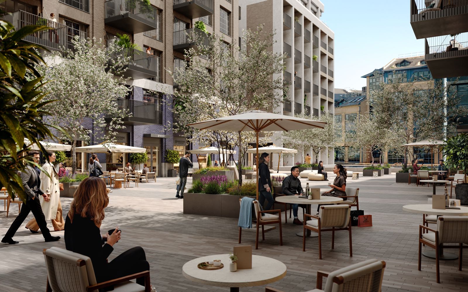 Ransome's Wharf Battersea SW11 London landscaped courtyard with outdoor dining, umbrellas and blossom trees