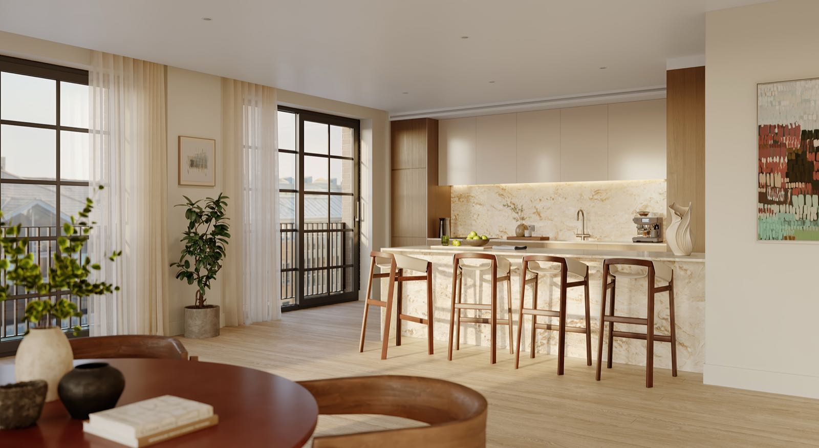 Ransome's Wharf Battersea SW11 London apartment kitchen with Corian stone breakfast bar, oak joinery and Crittall doors to balcony