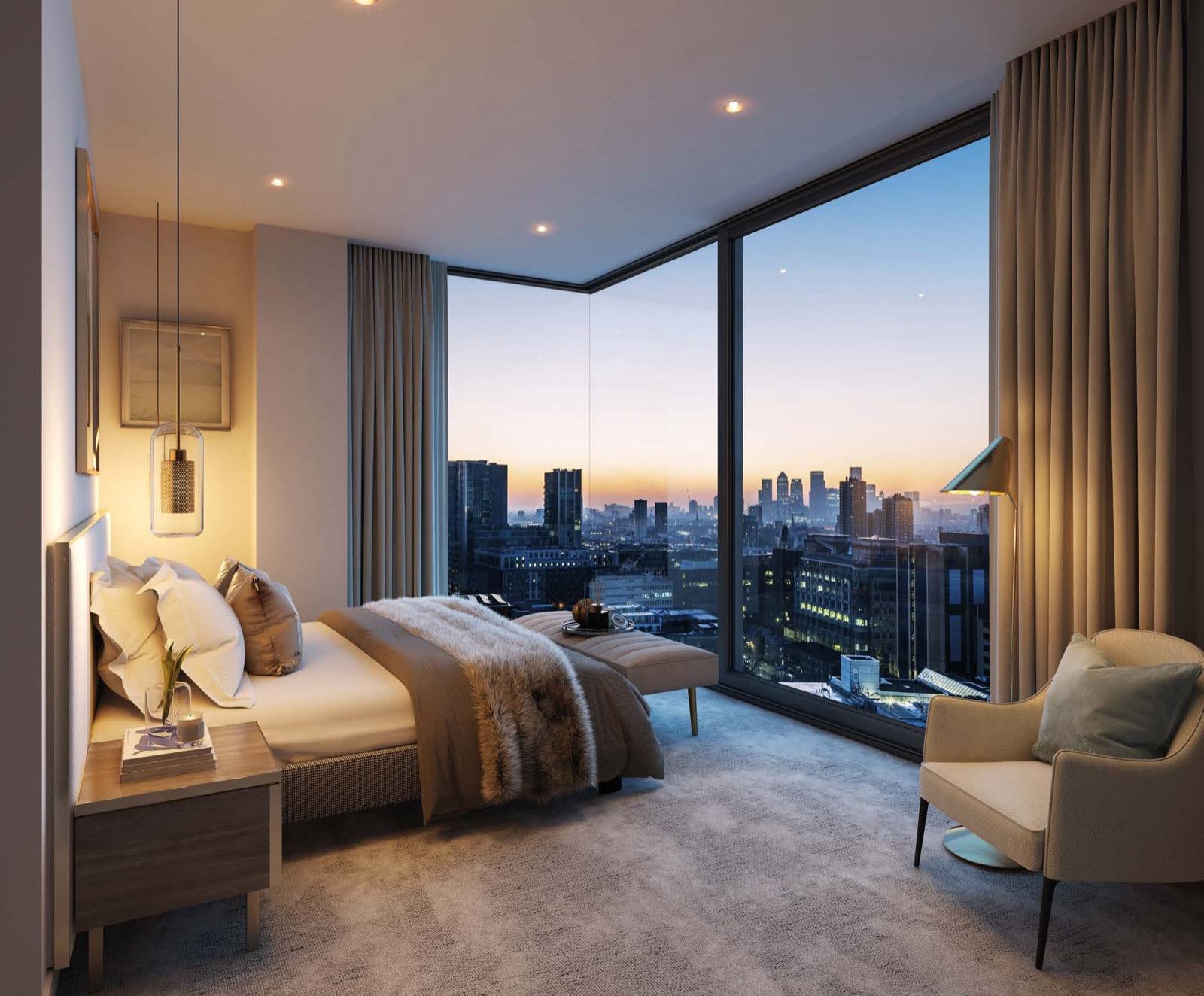 The Haydon Aldgate City of London apartment principal bedroom with corner windows and London skyline at dusk