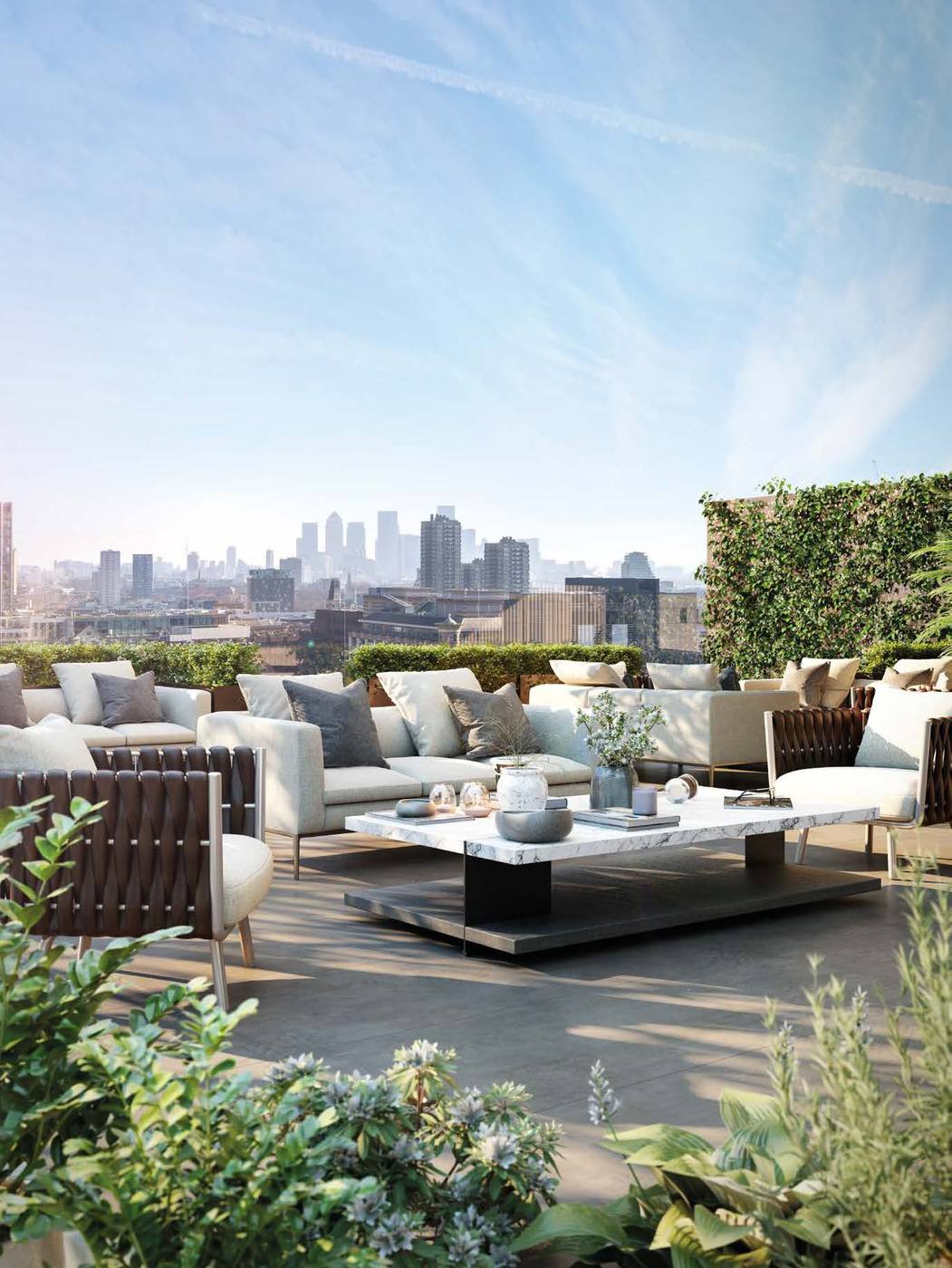 The Haydon Aldgate City of London rooftop terrace with outdoor lounge and Canary Wharf skyline view