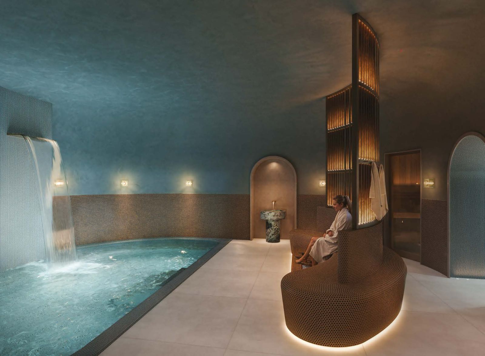 Trillium Paddington W2 London residents' hydrotherapy pool with waterfall feature at the wellness suite