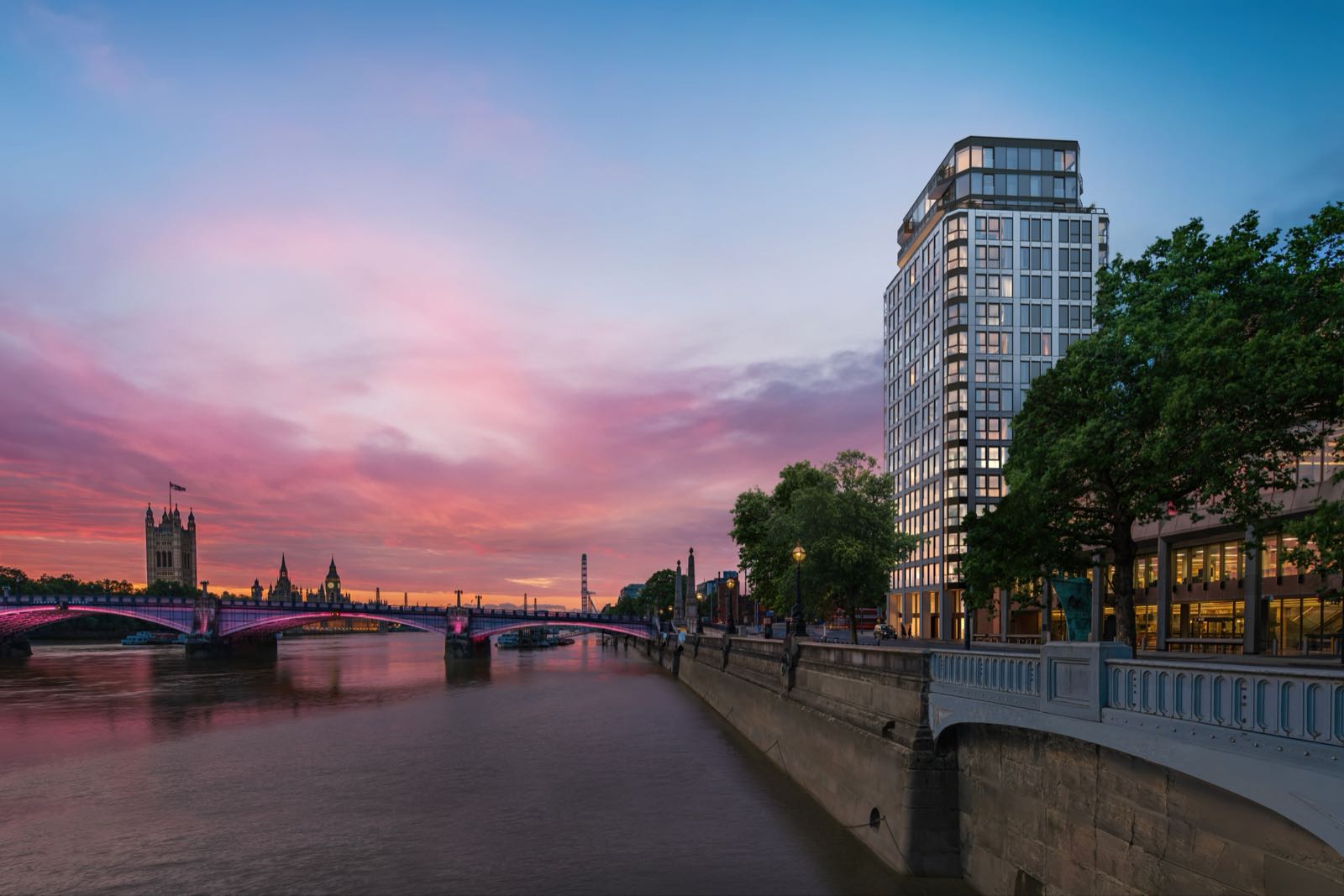 Westminster Tower SE1 Albert Embankment London tower exterior at dusk with Lambeth Bridge and Houses of Parliament at sunset