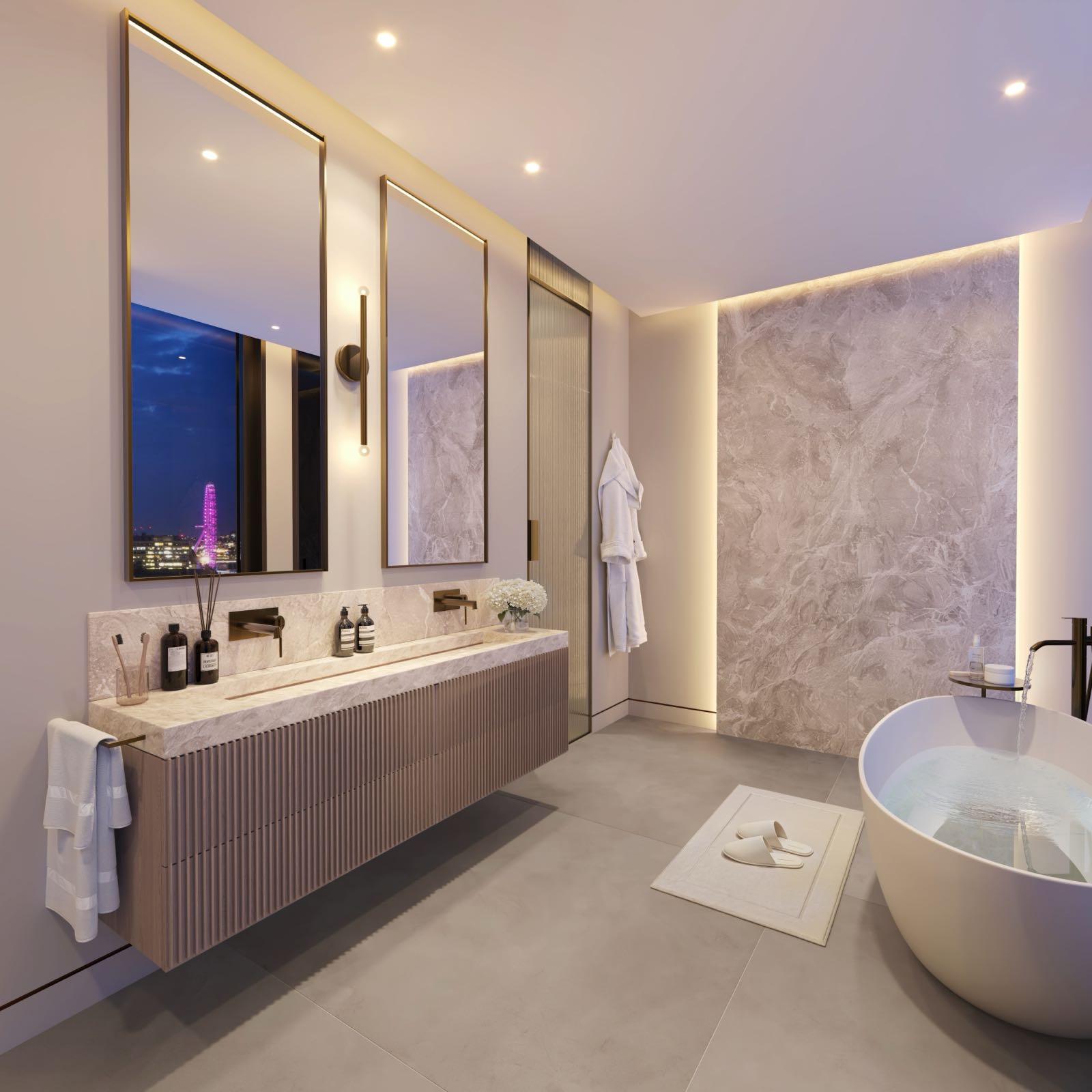 Westminster Tower SE1 Albert Embankment London luxury bathroom with freestanding bath, Statuario marble feature wall, fluted vanity and London Eye view